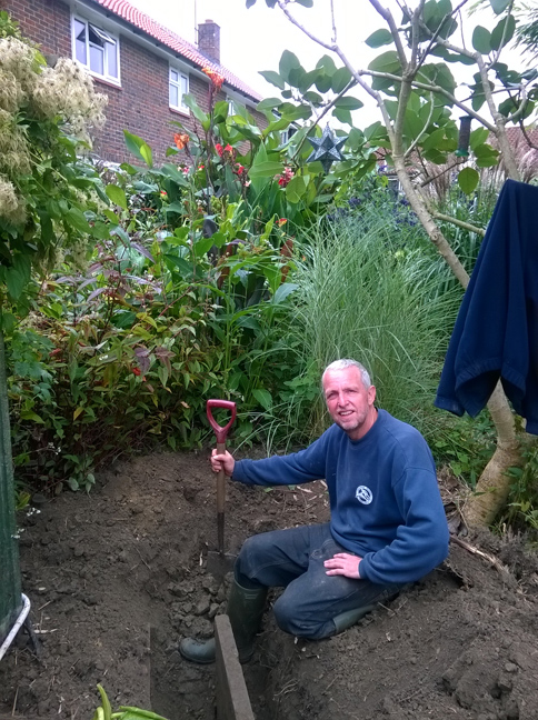 Tim digs another hole - preparing the site